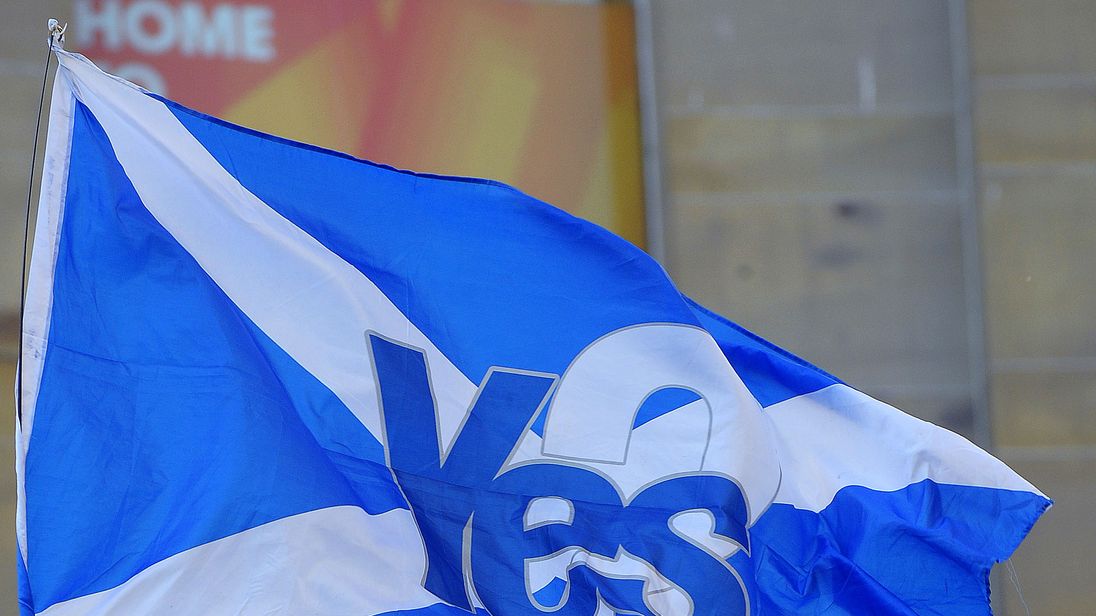 Flags flutter as pro-Catalan independence supporters hold a rally in Glasgow, Scotland