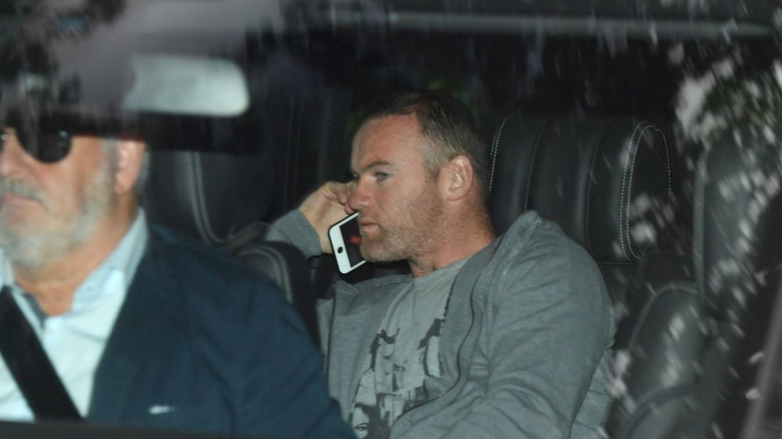 Wayne Rooney pictured returning home after being arrested and charged with drink driving