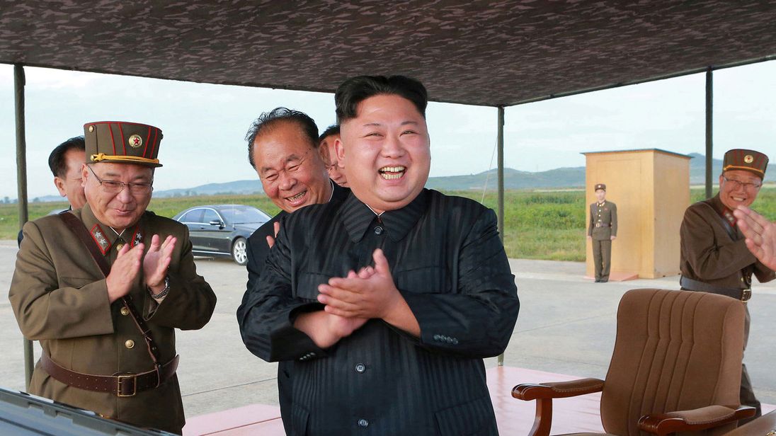 North Korean leader Kim Jong Un guides the launch of a Hwasong-12 missile 