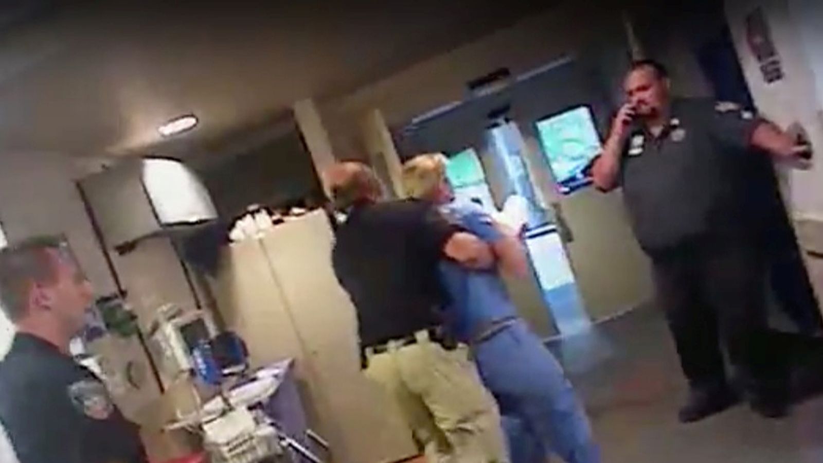 The nurse was dragged screaming out of the hospital and cuffed outside