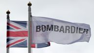 Flags fly above the Bombardier Aerospace plant in Belfast