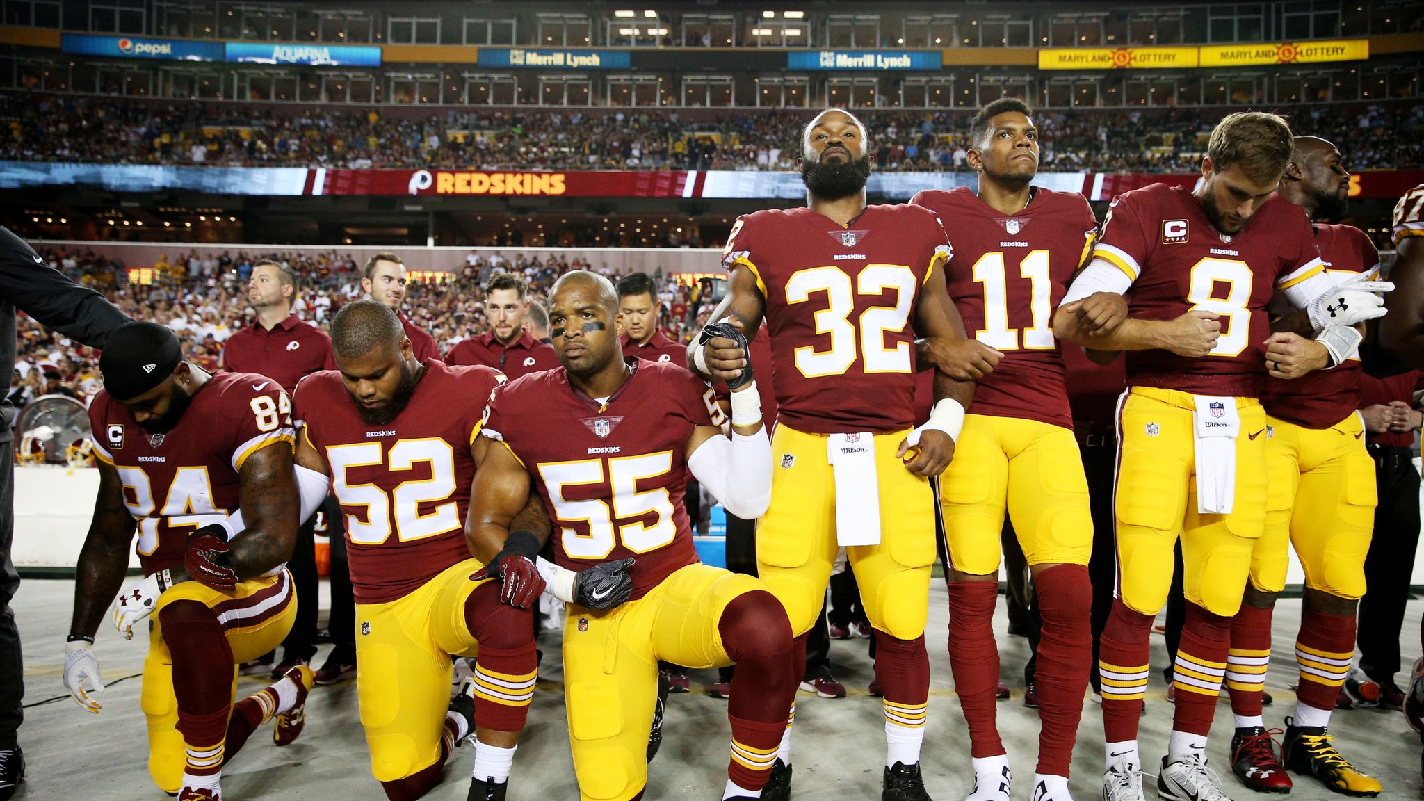 Cincinnati Bengals locked arms during the national anthem