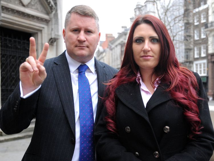 Paul Golding, leader of Britain First, and the party's deputy leader, Jayda Fransen, arrive at the Royal Courts of Justice in central London, where he is appearing in connection with an alleged breach of an injunction, relating to his activities around mosques.