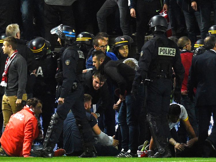 Police and stadium staff quickly began to help injured supporters