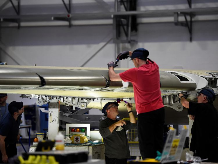 People work on a C Series aeroplane wing in the Bombardier factory in Belfast, Northern Ireland September 26, 2017