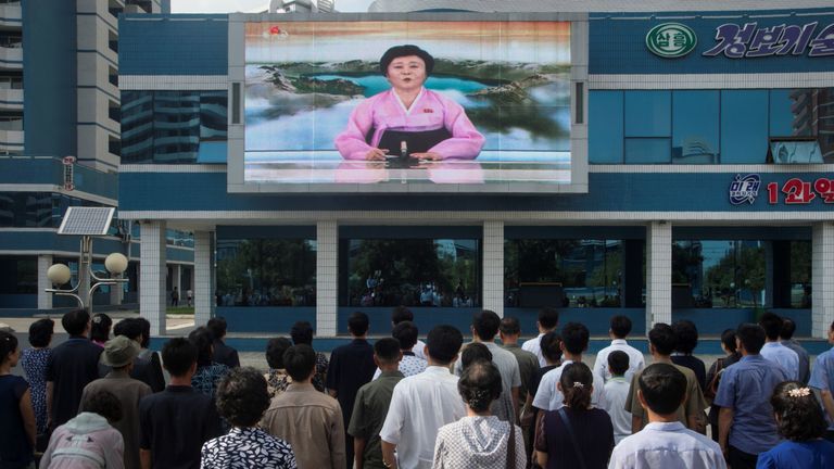 People watch Ri Chun-Hee in Pyongyang as she announces the latest nuclear test