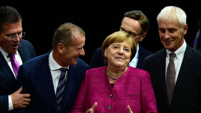 German Chancellor Angela Merkel visits the Volkswagen booth at the Frankfurt Motor Show