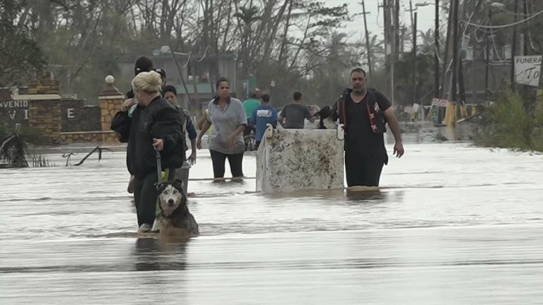 Army trucks have been helping people get out of submerged parts of Toa Baha 