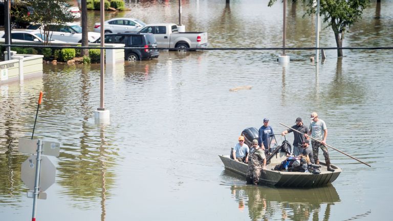 Rescue crews help Harvey flood victims