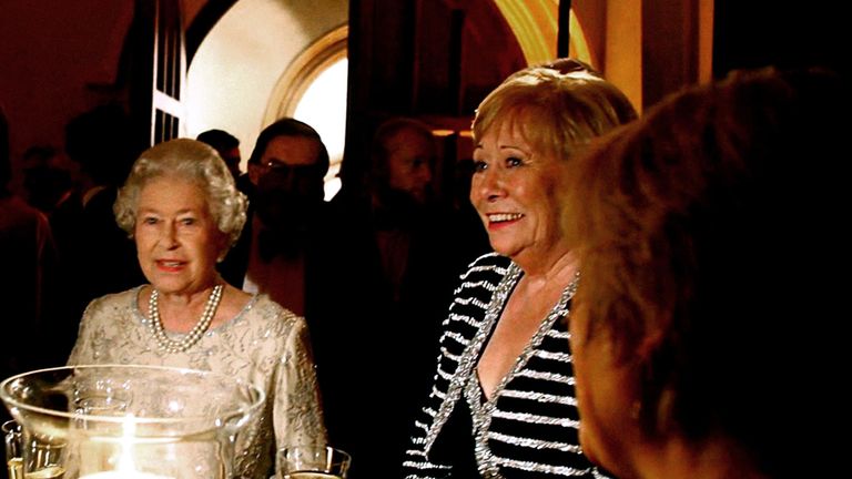 Queen Elizabeth chatting to guests at the ITV 50th Anniversary celebration, including Liz Dawn (centre right)