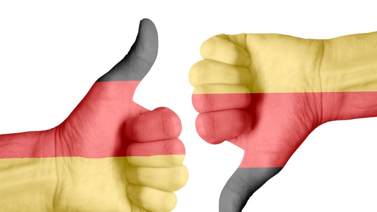 German flag on human hands - Stock image