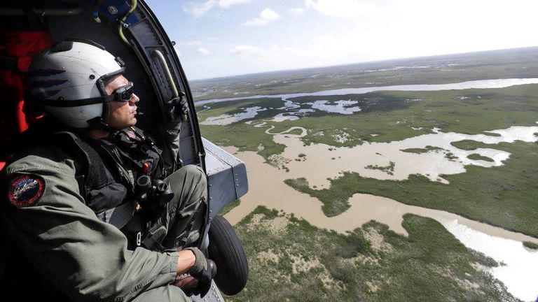 Senior Chief Naval Air Crewman Xipetotec Thorngate searches, during a reconnaissance mission over Key West, Florida