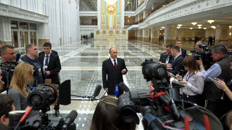 Russia&#39;s President Vladimir Putin speaks to journalists in the Belarus capital Minsk, on April 29, 2014, after attending a session of the Supreme Eurasian Economic Council . Putin warned yesterday that new EU and US sanctions could impact the work of Western energy firms in Russia and denied there were any Kremlin forces in eastern Ukraine