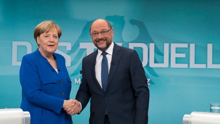 BERLIN, GERMANY - SEPTEMBER 3: In this handout picture provided by German television channel ARD, German Chancellor and Christian Democrat (CDU) Angela Merkel and German Social Democrat (SPD) and chancellor candidate Martin Schulz shake hands prior to a televised debate at ARD television studios on September 3, 2017 in Berlin, Germany. 