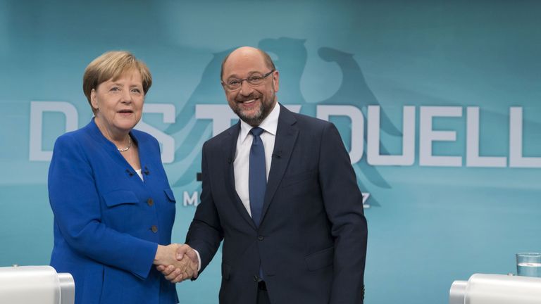 Angela Merkel and Martin Schulz shake hands prior to the debate 