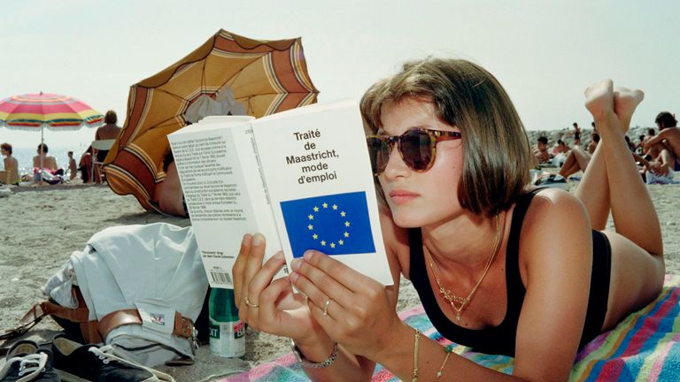 A student of politics reads the 'Maastricht treaty' on a beach in Marseille on August 19, 1992