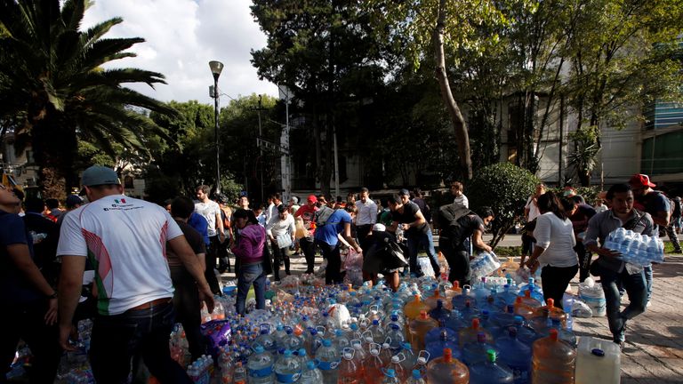 People donate water for rescue workers and victims 