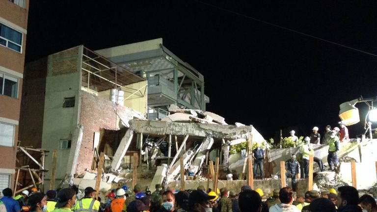 Rescue teams look for people trapped in the rubble at the Enrique Rebsamen elementary school