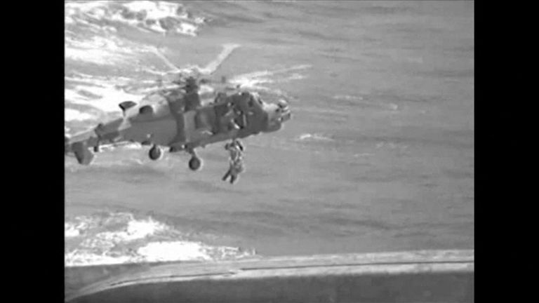 A Royal Navy helicopter hoisted the woman and her children to safety