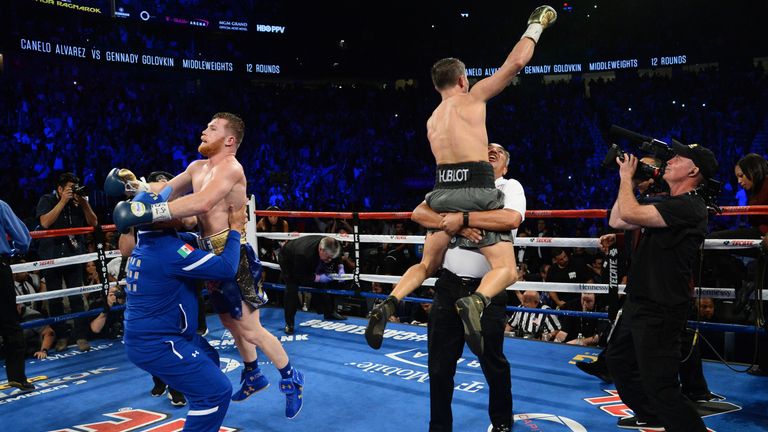 Gennady Golovkin (R) and Canelo Alvarez (L) both celebrate at the end of the bout