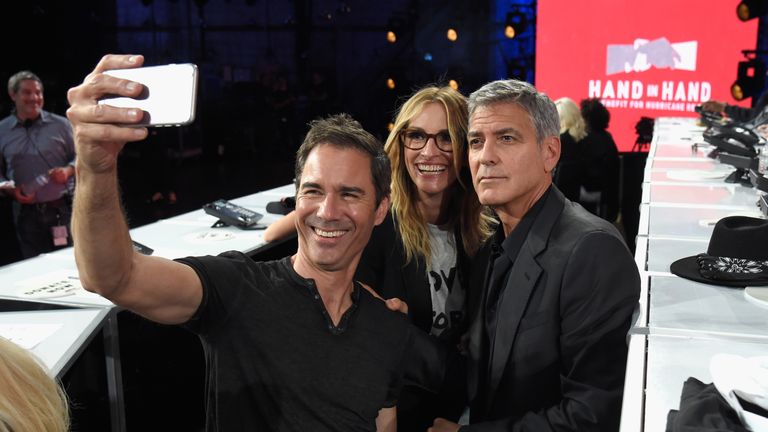 UNIVERSAL CITY, CA - SEPTEMBER 12: In this handout photo provided by Hand in Hand, Eric McCormack, Julia Roberts and George Clooney attend Hand in Hand: A Benefit for Hurricane Relief at Universal Studios AMC on September 12, 2017 in Universal City, California. (Photo by Kevin Mazur/Hand in Hand/Getty Images)