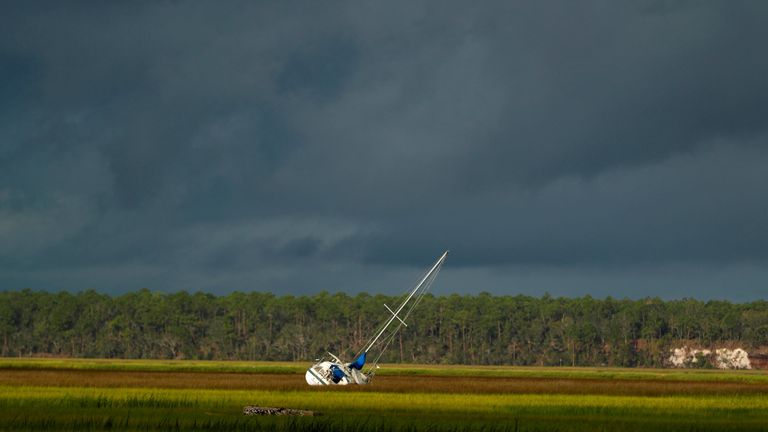 A boat is seen after being blown from the dock into the marsh after Hurricane Irma passed through in St Marys, Georgia