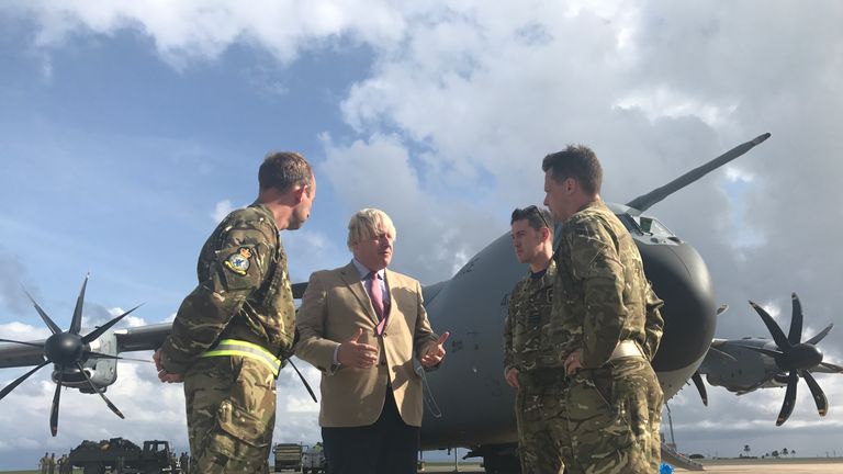 Boris Johnson speaks to an RAF crew on his visit to the Caribbean