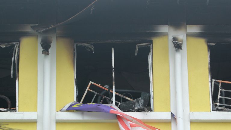 Burnt windows of the Darul Quran Ittifaqiyah religious school in Kuala Lumpur