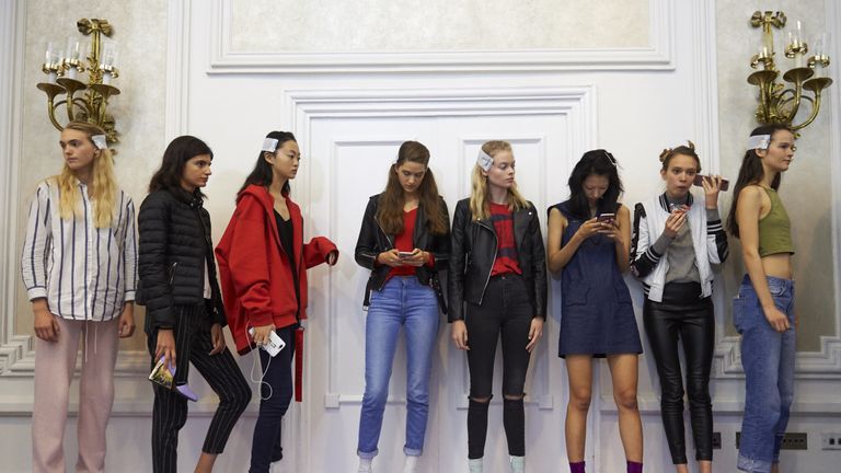 Models wait backstage ahead of the catwalk show by Peter Pilotto 