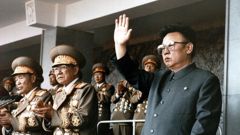 This file photo taken on October 10, 1995 shows North Korean leader Kim Jong-Il (R) waving at a military parade to celebrate the 50th anniversary of the founding of the Workers&#39; Party of Korea (WPK)