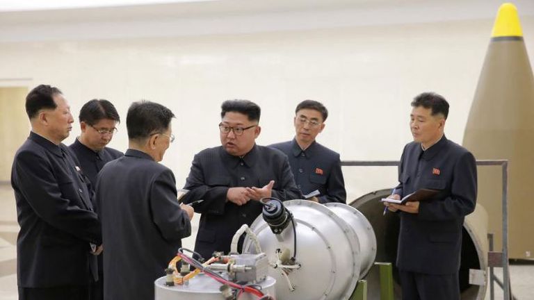 Kim Jong Un examining the purported weapon