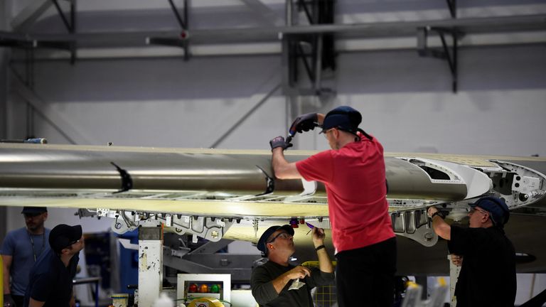 People work on a C Series aeroplane wing in the Bombardier factory in Belfast, Northern Ireland September 26, 2017