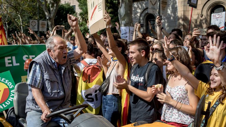 Students cheer and shout as they join a pro-independence farmers&#39; protest