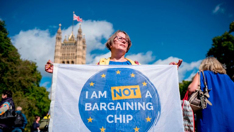 Demonstrators hold banners during a protest to Lobby MPs to guarantee the rights of EU citizens living in the UK, after Brexit, outside the Houses of Parliament in central London on September 13, 2017. After navigating the first hurdle of a key Brexit bill, British Prime Minister Theresa May on Tuesday won another parliamentary vote which will help prevent opposition MPs from blocking future legislation