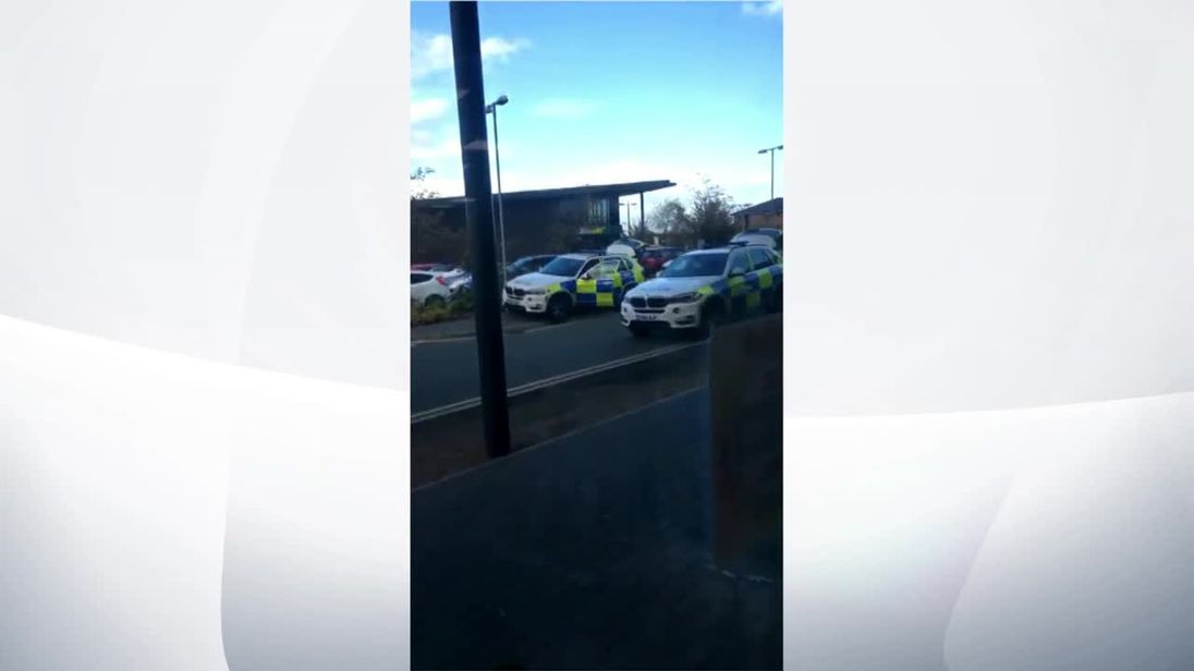 Armed police at the scene of leisure park where gunman is holding hostages.