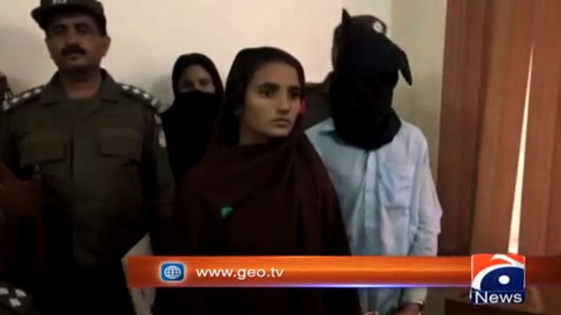 Asiya Bibi is flanked by Pakistani police after her arrest. Pic: Geo News