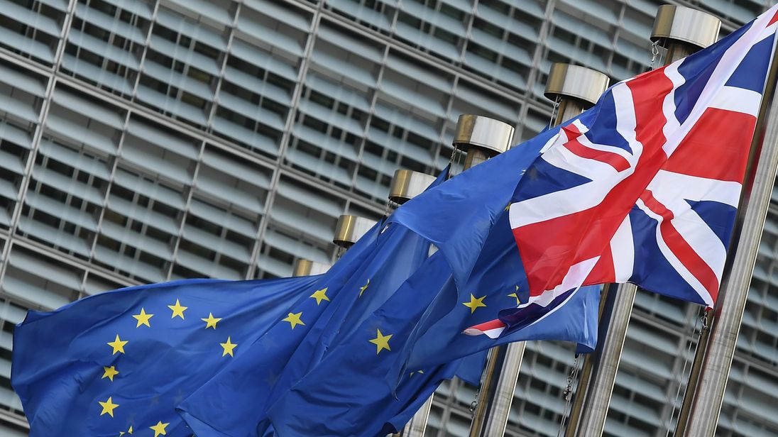 The Union Jack flag flies next to European Union flags in front of the European Commission building as British Prime Minister May is due to meet European Commission President Juncker