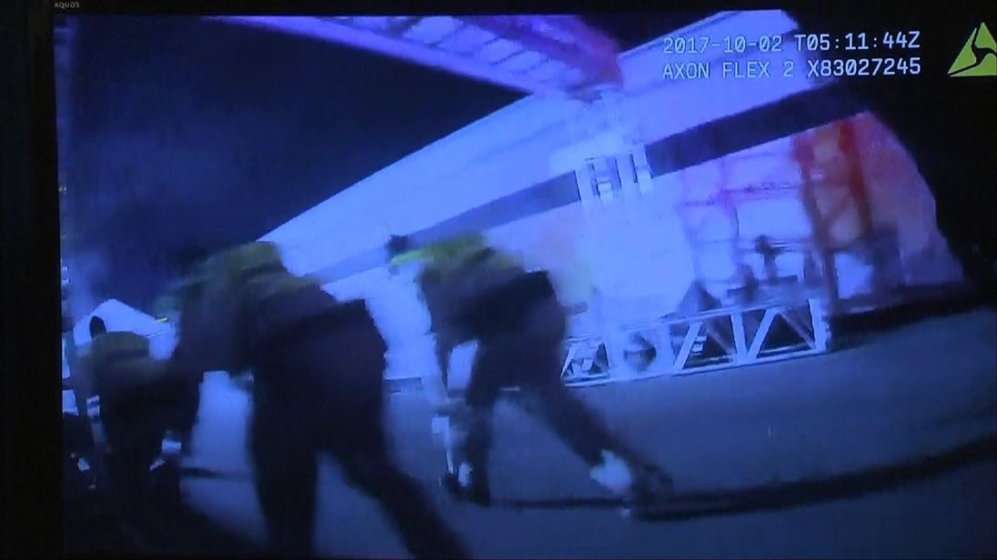 Police bodycam footage shows officers sheltering from the gunman's bullets