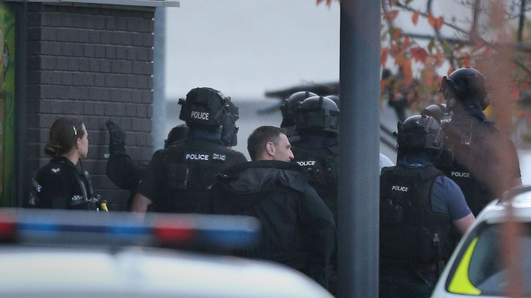 Police in Nuneaton where a gunman is holding two bowling alley members of staff hostage