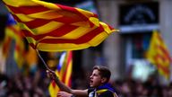 A boy waves a Catalan flag as people celebrate at the Sant Jaume square in Barcelona on October 27, 2017. Catalonia&#39;s parliament voted to declare independence from Spain and proclaim a republic, just as Madrid is poised to impose direct rule on the region to stop it in its tracks. A motion declaring independence was approved with 70 votes in favour, 10 against and two abstentions, with Catalan opposition MPs walking out of the 135-seat chamber before the vote in protest at a declaration unlikely