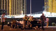 Las Vegas police stand guard along the streets outside the the Route 91 Harvest country music festival