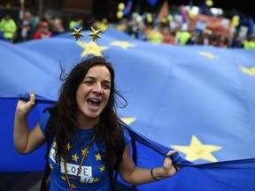 Protesters take part in an anti-Brexit demonstration in Manchester to coincide with the first day of the Conservative Party annual conference at the Manchester Central Convention Centre, on October 1, 2017