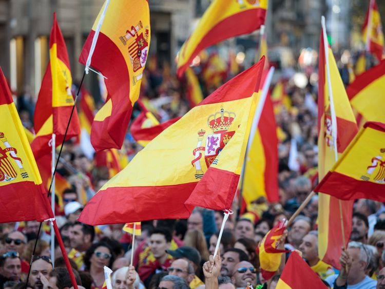 BARCELONA, SPAIN - OCTOBER 29: Protesters wave Spanish flags during a pro-unity demonstration on October 29, 2017 in Barcelona, Spain. Thousands of pro-unity protesters gather in Barcelona, two days after the Catalan Parliament voted to split from Spain. The Spanish government has responded by imposing direct rule and dissolving the Catalan parliament. (Photo by Jack Taylor/Getty Images)