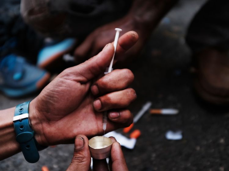 A heroin user on the street in a South Bronx neighbourhood