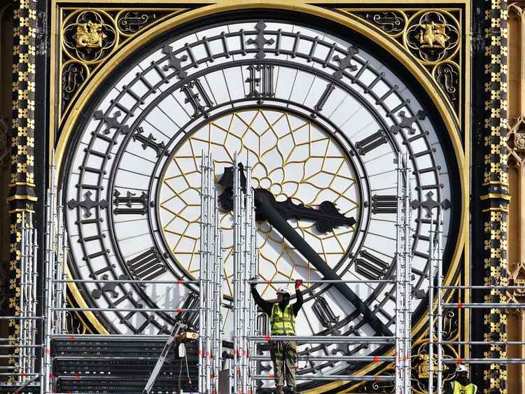 Construction workers build scaffolding around the Elizabeth Tower, also known as Big Ben, during ongoing conservation works at the Houses of Parliament, Westminster, London