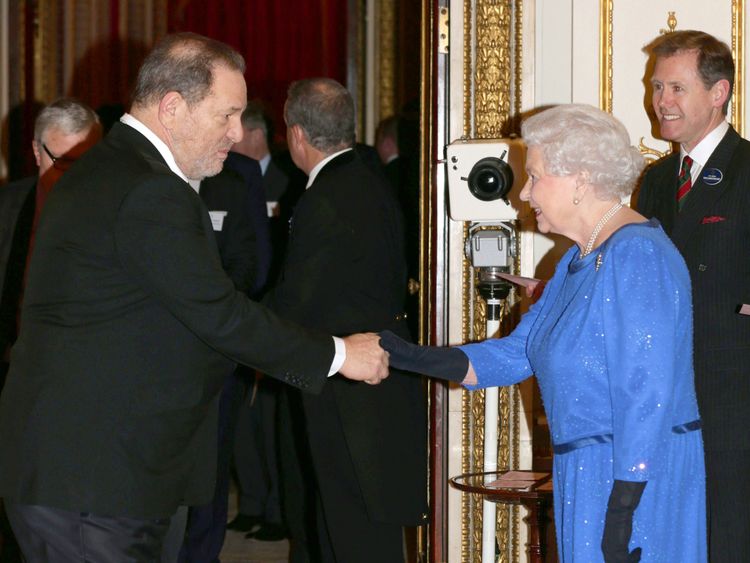 Queen Elizabeth II meets Harvey Weinstein during the Dramatic Arts reception at Buckingham Palace on February 17, 2014