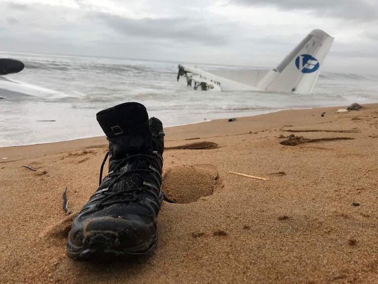 A shoe on the beach after six people were rescued from a down plane in Ivory Coast
