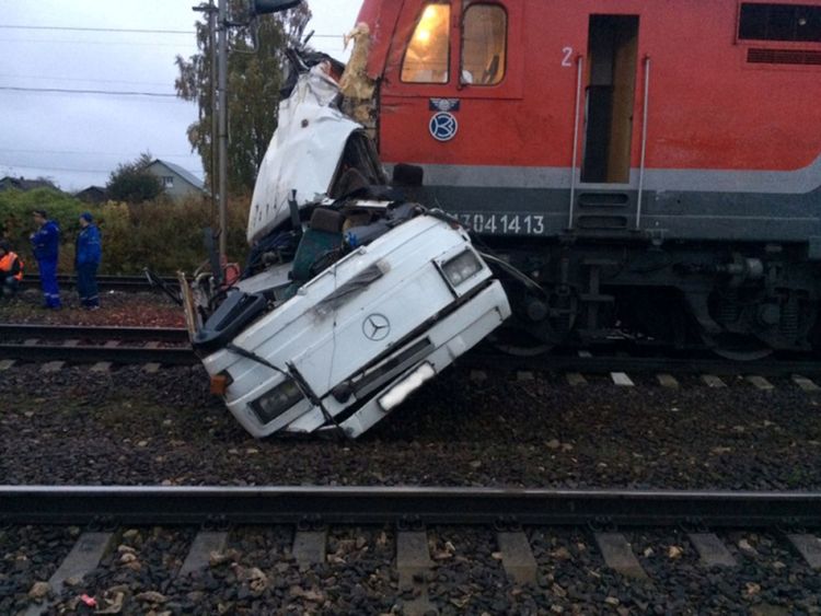 The wreckage of a passenger bus after it was hit by a train at a crossing near the town of Pokrov, in Vladimir region, Russia 