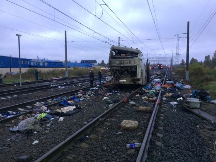 The wreckage of a passenger bus after it was hit by a train at a crossing near the town of Pokrov, in Vladimir region, Russia