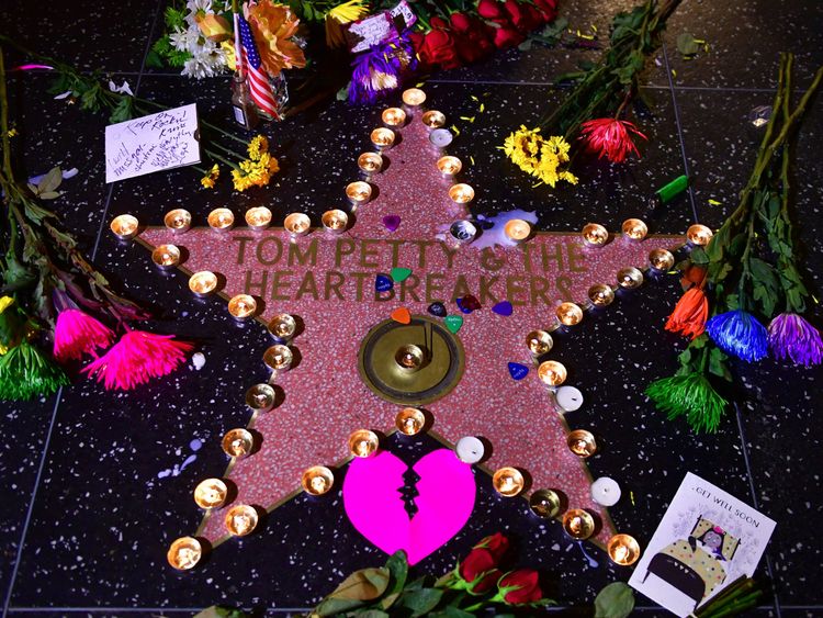 Candles and flowers are placed on the Hollywood Walk of Fame Star of the late Tom Petty in Hollywood, California on October 2, 2017 